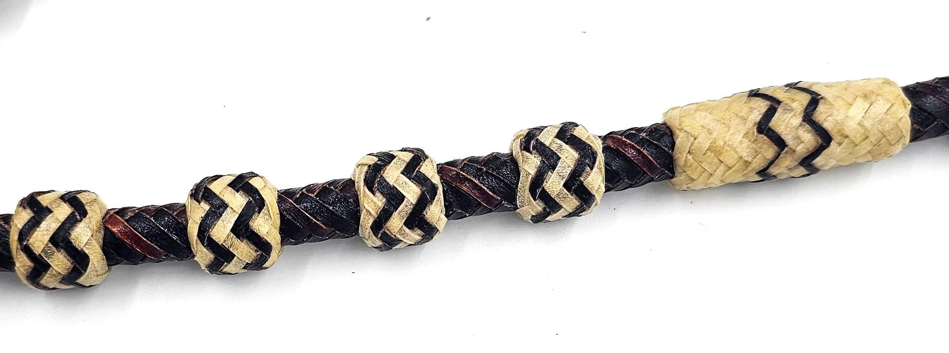 Braided Black Rawhide reins with white toned buttons and leather popper ends